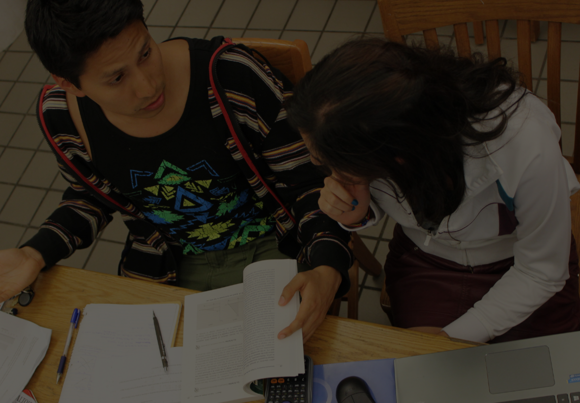 students in csf course at desk - darkened